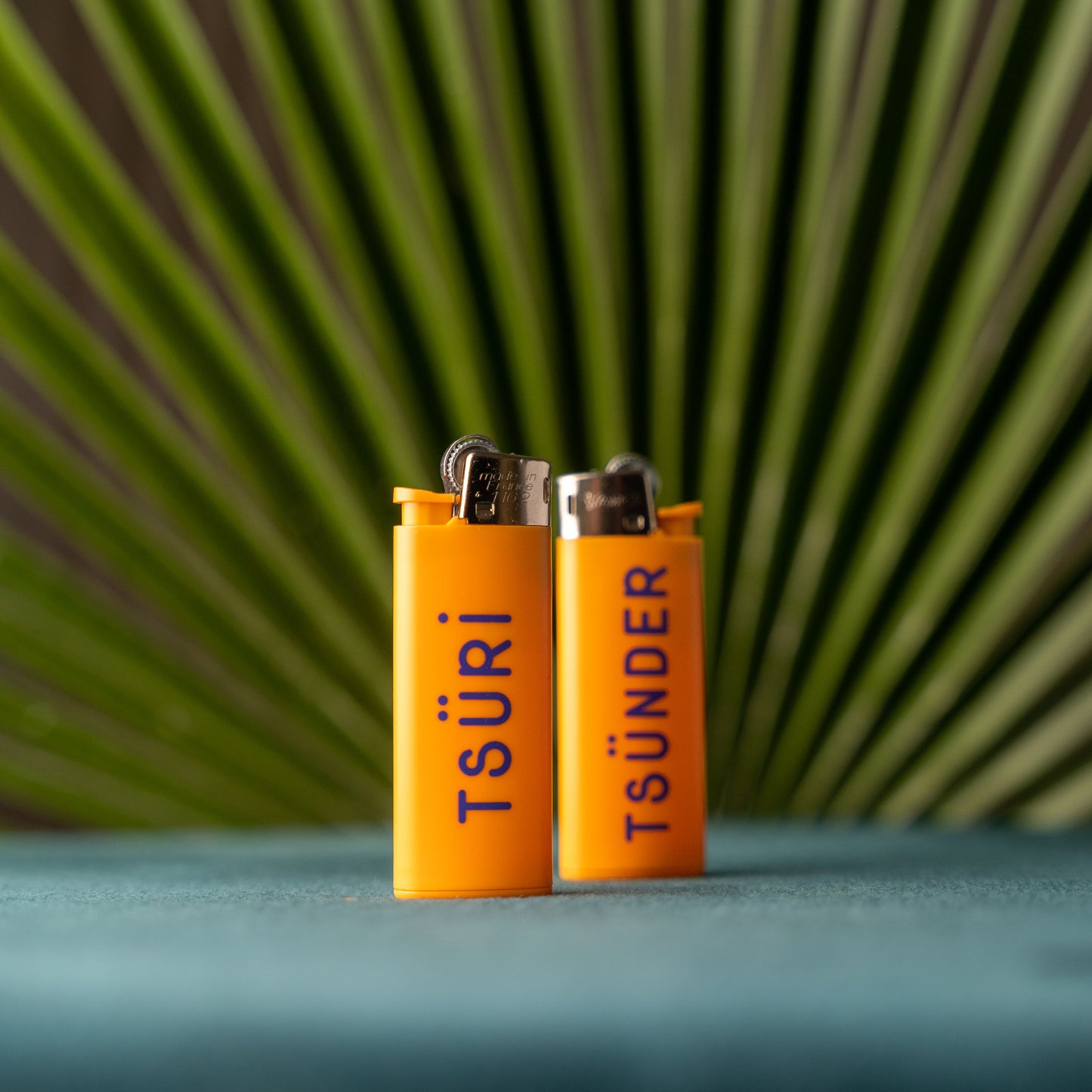 Oranges Bic Feuerzeug mit der Aufschrift Tsüri und Tsünder